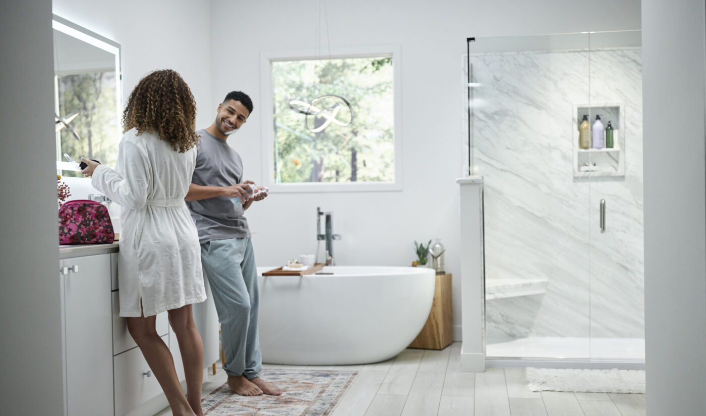 Man and woman getting ready in a beautiful bathrooom